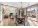 Bright dining area with view into the living room at 3953 Blue Pine Cir, Highlands Ranch, CO 80126