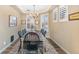 Bright dining room with large windows and a rustic farmhouse table at 3953 Blue Pine Cir, Highlands Ranch, CO 80126