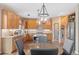 Eat-in kitchen with hardwood floors and large island at 3953 Blue Pine Cir, Highlands Ranch, CO 80126