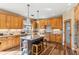 Kitchen boasts granite countertops and wooden cabinetry at 3953 Blue Pine Cir, Highlands Ranch, CO 80126