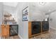 Convenient laundry room with washer, dryer, and wine cooler at 3953 Blue Pine Cir, Highlands Ranch, CO 80126