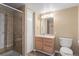 Bathroom featuring a glass shower and wood vanity at 6904 Sprucedale Pkwy, Evergreen, CO 80439