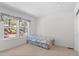 Bright bedroom with a large window at 6904 Sprucedale Pkwy, Evergreen, CO 80439