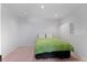 Bright bedroom with white walls, recessed lights, and pink carpet at 6904 Sprucedale Pkwy, Evergreen, CO 80439