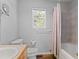Bright bathroom showcasing a shower/tub, neutral walls and a window for natural light at 6904 Sprucedale Pkwy, Evergreen, CO 80439