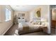 Bedroom with light tan walls, carpeted floor, decorative art, and comfortable bed at 6904 Sprucedale Pkwy, Evergreen, CO 80439