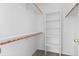 Neat walk-in closet with shelves and hanging rods at 6904 Sprucedale Pkwy, Evergreen, CO 80439