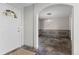 Entryway view into the dining room with chair railing, chandelier and tile floors at 6904 Sprucedale Pkwy, Evergreen, CO 80439
