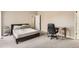 Cozy bedroom with a bed, desk and chair on neutral carpet, and great natural light at 9551 E Chenango Ave, Greenwood Village, CO 80111