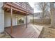 A wood deck is attached to the home overlooking the backyard with access to a sliding glass door at 9551 E Chenango Ave, Greenwood Village, CO 80111