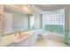 Bathroom with art deco tile, sink, toilet, tub and shower at 291 Magnolia St, Denver, CO 80220