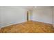 Empty bedroom featuring parquet wood flooring and neutral walls, ready for personal touches at 291 Magnolia St, Denver, CO 80220