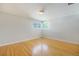 Bedroom featuring hardwood floors and a bright window at 291 Magnolia St, Denver, CO 80220