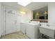 Well-equipped laundry room with washer, dryer, utility sink, and tiled flooring at 291 Magnolia St, Denver, CO 80220