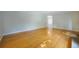 Spacious living room featuring lustrous hardwood floors, neutral paint, and natural light at 291 Magnolia St, Denver, CO 80220
