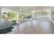 Bright sun room featuring tile floors and sliding glass doors leading to the outdoors at 291 Magnolia St, Denver, CO 80220
