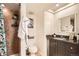 Bathroom featuring tile floors, a shower, and vanity sink at 701 Harlan St # E59, Lakewood, CO 80214