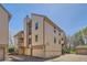 Exterior shot of a two story townhome with garages at 701 Harlan St # E59, Lakewood, CO 80214
