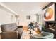 Spacious living room with fireplace, natural light, and an open layout at 701 Harlan St # E59, Lakewood, CO 80214