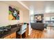 Charming bar area adjacent to a cozy living room with a fireplace and access to the balcony at 701 Harlan St # E59, Lakewood, CO 80214