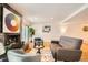 Bright and airy living room with a modern fireplace and a cozy seating arrangement at 701 Harlan St # E59, Lakewood, CO 80214