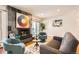 Comfortable living room with fireplace, modern furnishings, and access to outdoor balcony at 701 Harlan St # E59, Lakewood, CO 80214