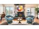 Inviting living room featuring a striking fireplace, modern furnishings, and plenty of natural light at 701 Harlan St # E59, Lakewood, CO 80214