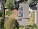 Aerial view of a home featuring solar panels, wood deck, and a well-kept, landscaped backyard at 7376 S Jackson St, Centennial, CO 80122