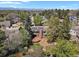 Aerial view of home showcasing a wood deck, landscaped backyard, and installed solar panels on the roof at 7376 S Jackson St, Centennial, CO 80122