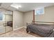 Basement bedroom featuring tile flooring, mirror sliding closet doors, and a window at 7376 S Jackson St, Centennial, CO 80122