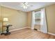 Bright bedroom with hardwood floors and a large window offering natural light at 7376 S Jackson St, Centennial, CO 80122