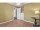 Bedroom features hardwood floors, neutral walls, and a spacious layout at 7376 S Jackson St, Centennial, CO 80122