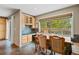 Eat-in kitchen features a cozy breakfast nook with views of the backyard at 7376 S Jackson St, Centennial, CO 80122