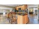 Spacious kitchen with custom wood cabinets, granite countertops, and an open design perfect for entertaining at 7376 S Jackson St, Centennial, CO 80122