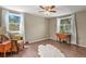 Comfortable living area featuring hardwood floors, an armchair, and lots of natural light at 7376 S Jackson St, Centennial, CO 80122