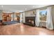 Inviting living room connects to the kitchen and features a cozy fireplace at 7376 S Jackson St, Centennial, CO 80122