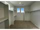 Spacious walk-in closet with lots of shelving providing plenty of storage space at 605 Twilight St, Erie, CO 80516