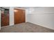 A finished basement with a large wooden closet at 7971 Olive St, Commerce City, CO 80022