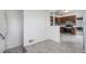 View of a kitchen with wood cabinets and stainless steel appliances, with modern flooring at 7971 Olive St, Commerce City, CO 80022
