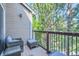 Relaxing balcony seating area with a view of lush greenery and trees at 7409 S Alkire St # 304, Littleton, CO 80127