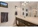 Bathroom with a vanity, cabinets and drawers for storage, and a shower over bathtub at 7409 S Alkire St # 304, Littleton, CO 80127