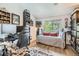 Bedroom with a work area and a sitting area. Large window provides plenty of natural light at 7409 S Alkire St # 304, Littleton, CO 80127