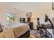 Bedroom with a large window, allowing for plenty of natural light and beautiful views at 7409 S Alkire St # 304, Littleton, CO 80127