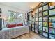 Bedroom with an abundance of bookshelves and a cozy sitting area at 7409 S Alkire St # 304, Littleton, CO 80127