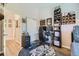 Comfortable bedroom with a desk and shelves, creating a versatile space for work and rest at 7409 S Alkire St # 304, Littleton, CO 80127
