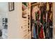 Walk-in closet with custom shelving and hanging space for organized storage and easy access at 7409 S Alkire St # 304, Littleton, CO 80127