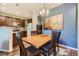 Inviting dining area adjacent to the kitchen, featuring a wooden table and stylish accents at 7409 S Alkire St # 304, Littleton, CO 80127
