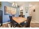 Elegant dining room with stylish lighting, hardwood floors, and ample space for entertaining at 7409 S Alkire St # 304, Littleton, CO 80127
