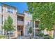 Inviting multi-story condo with stone facade and well-maintained landscaping, creating a welcoming curb appeal at 7409 S Alkire St # 304, Littleton, CO 80127