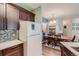 Charming kitchen with modern appliances and convenient access to the dining area at 7409 S Alkire St # 304, Littleton, CO 80127
